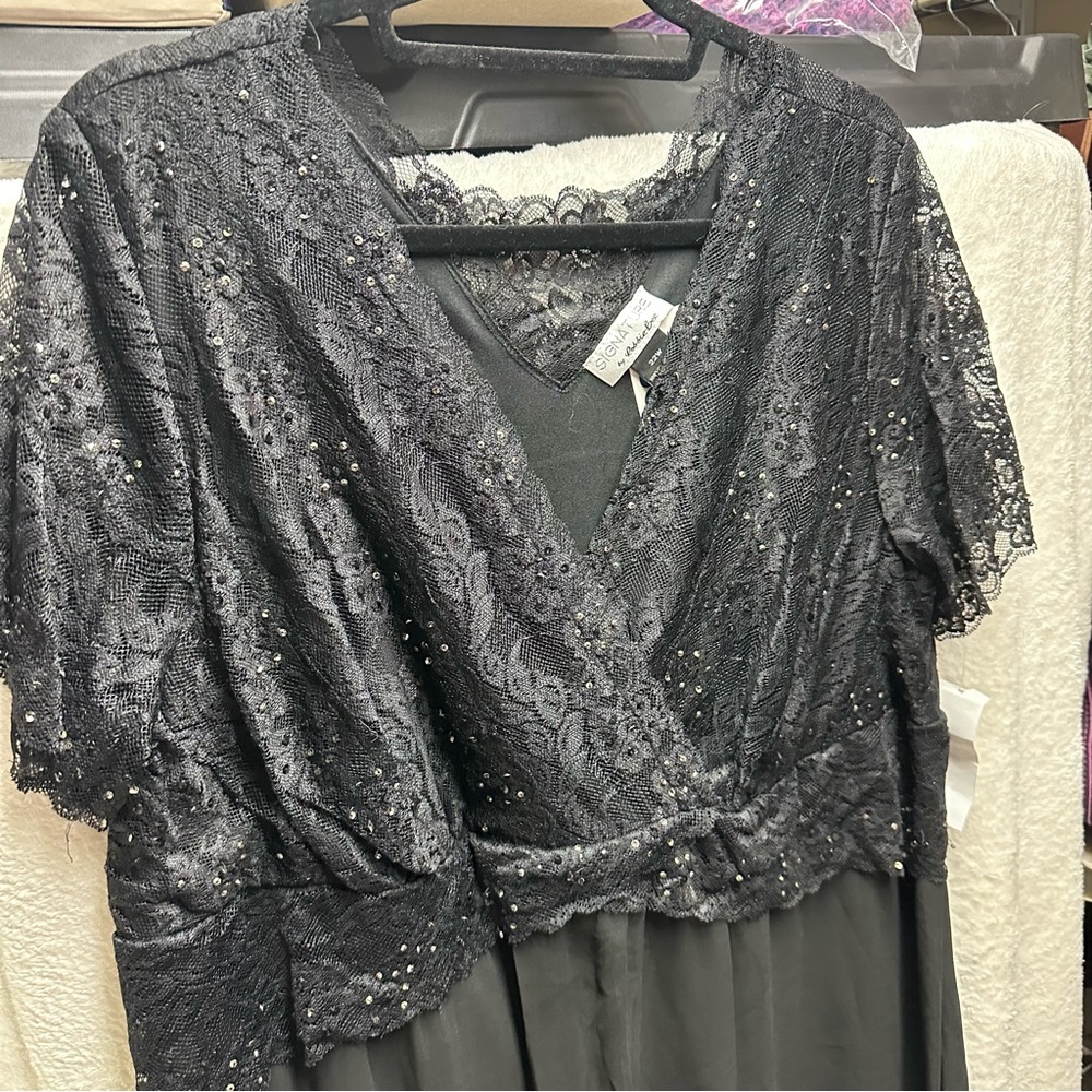 Black 2x dress. New with tags. Mid calf length